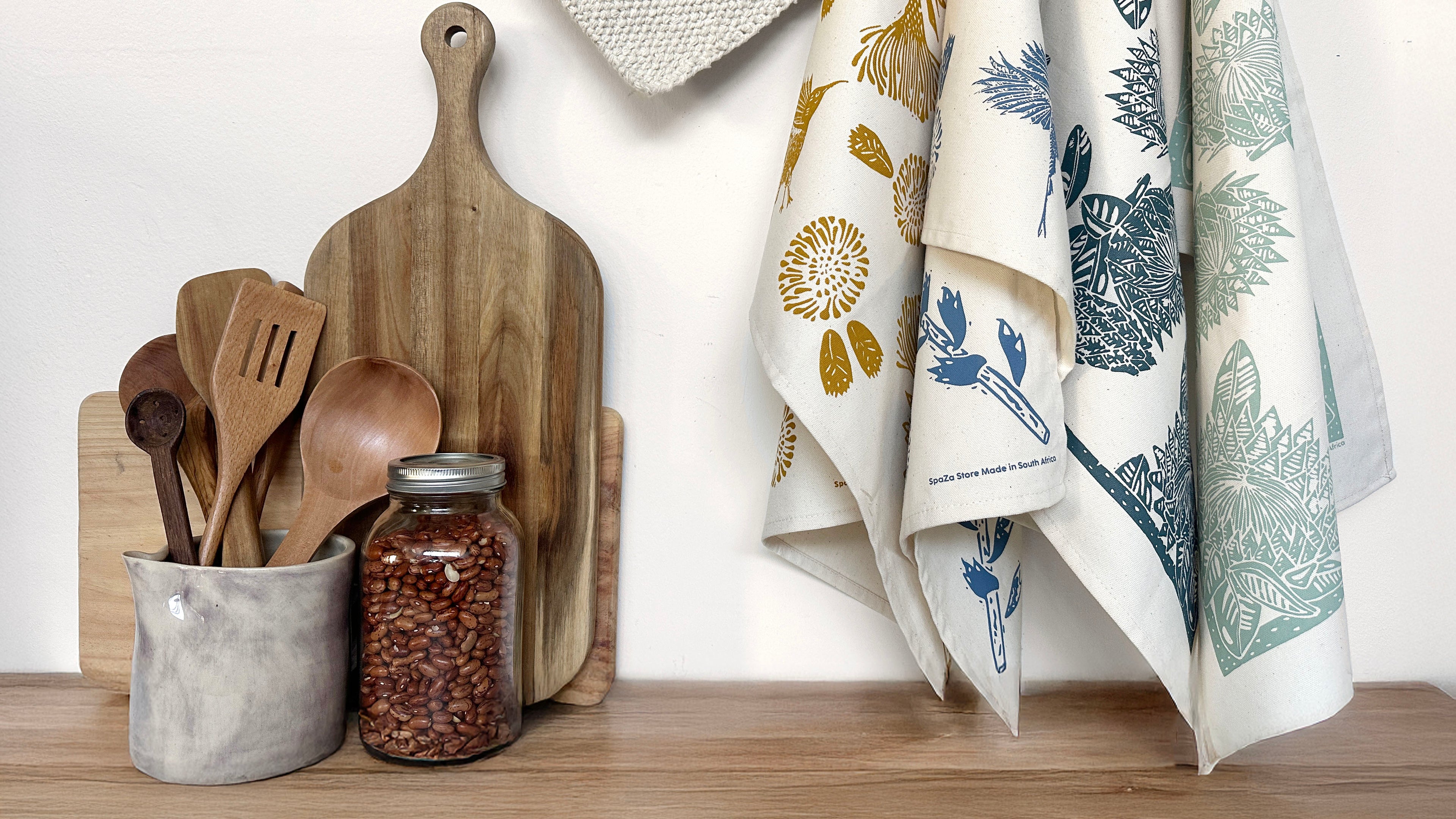 Cotton tea towels hanging in a kitchen